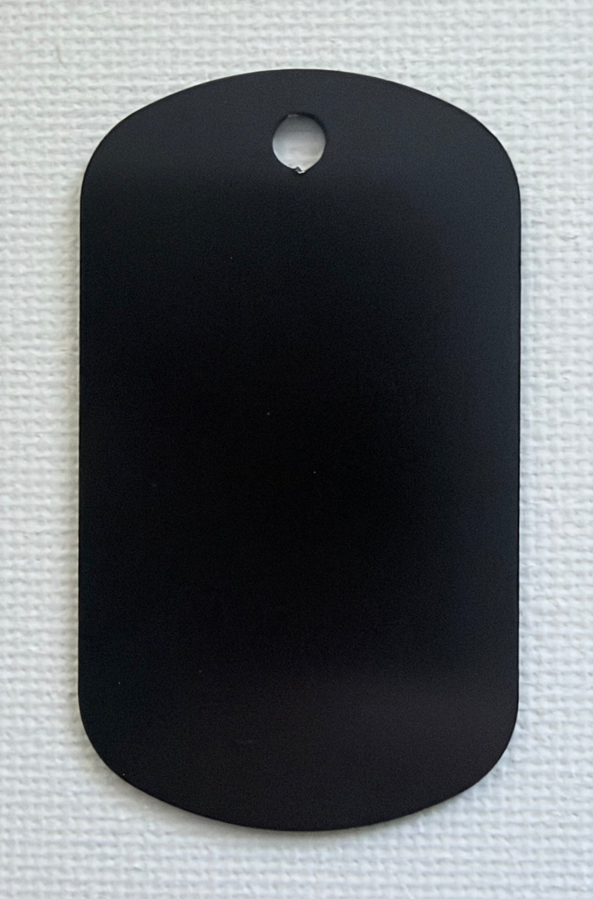 Close-up of a personalised laser engraved aluminium photo keyring