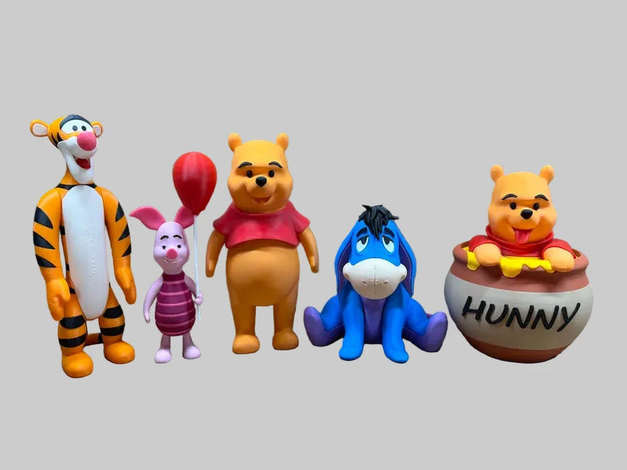 reference photograph of Pooh, Piglet and Eeyore figures